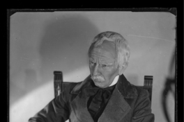 [Personificación de un anciano sentado en una silla]