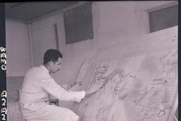 [realizando una pintura artística sobre un mural de azulejo]