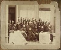 [Comisión de la Patagonia, grupo de hombres junto a unas mesas con mapas]