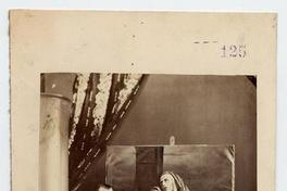 [Retrato de un pintor, junto a una pintura con una imagen religiosa]